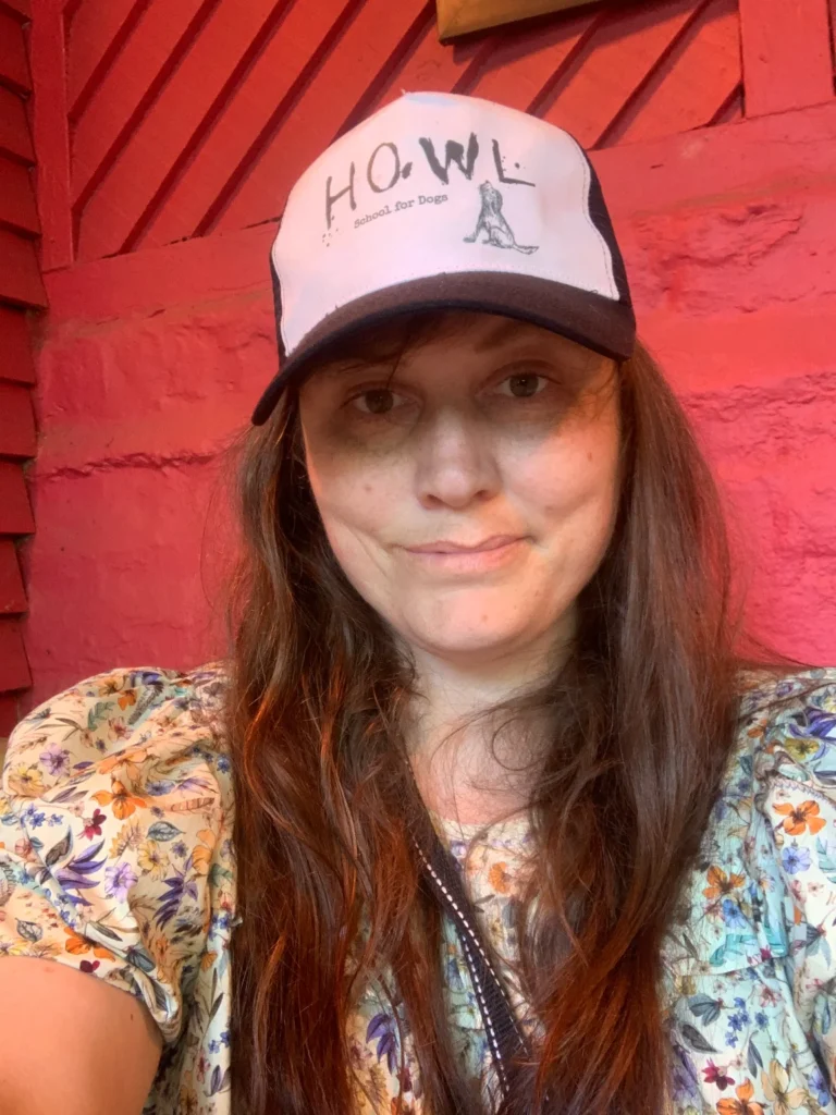 Kerry Howl School For Dogs wearing cap